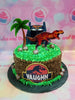 This delightful Dinosaurs Cake is a perfect choice for your child's next birthday party. Boasting a custom design with a t-rex, raptor, and other jurrasic elements, this eye-catching cake is sure to make your little one smile. The beautiful green and brown icing helps bring your child's favorite Dinosaur theme to life with vibrant colors.