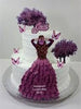 White buttercream two-tier cake with purple ruffle dress design, butterfly toppers, and a script name topper reading Josi