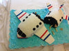 3D airplane cake in white fondant with windows and blue base, novelty design with fuselage in two sections