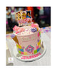 Pink Roblox-themed round buttercream cake with printed topper, multicolor block pattern, waffle cones, and a number 7 plaque