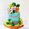 Roblox theme tall round cake in light blue fondant with brick wall wrap, two avatar toppers and number 12