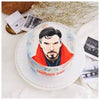 Round white buttercream cake with edible print of a caped sorcerer superhero on top, blue and red accents