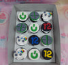 A stunning collection of video game-themed cupcakes featuring white, black, green, gray, red, and yellow colors, perfect for a 12th birthday celebration. The design showcases iconic elements such as Xbox controllers, Game Boy, PlayStation, and Nintendo motifs, elegantly arranged to celebrate the birthday theme.