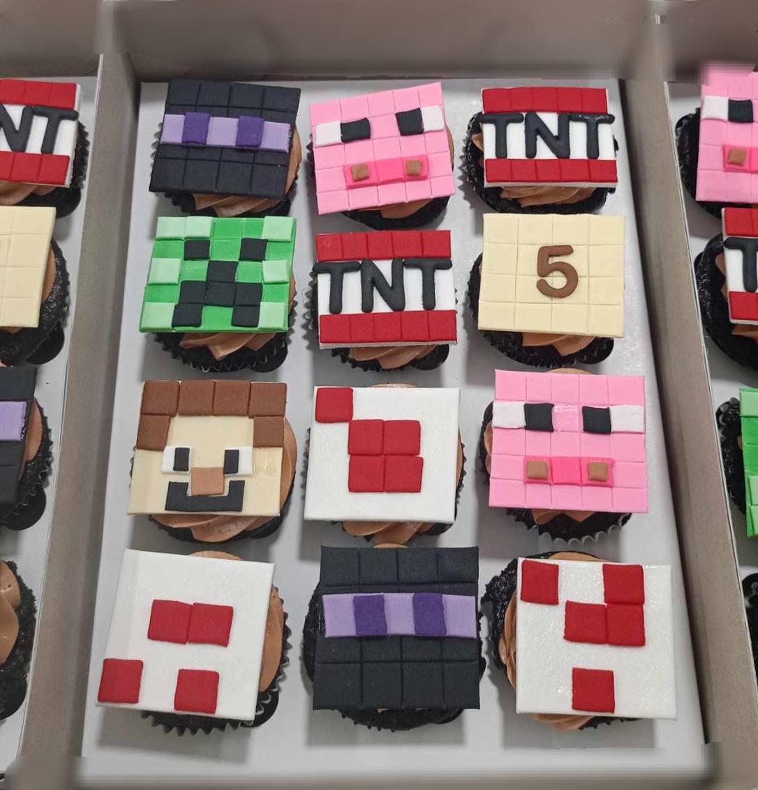 This custom Minecraft-themed cake features colorful cupcakes adorned with printout toppers showcasing Steve, TNT, and iconic blocks, perfect for video game enthusiasts. Ideal for Xbox and PlayStation fans, this cake captures the essence of the beloved game.