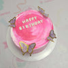 The Butterflies Cake features a stunning pink swirl design adorned with delicate butterfly decorations and colorful sprinkles. This one-tier birthday cake is perfect for any girl’s celebration, enhanced by charming printout toppers.