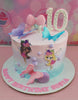 A whimsical pink and blue fairy cake adorned with charming fairies and butterflies perfect for a 10th birthday celebration. This delightful one-tier design captures the magic of Tinkerbell and Winx, making it a great addition to any birthday party.