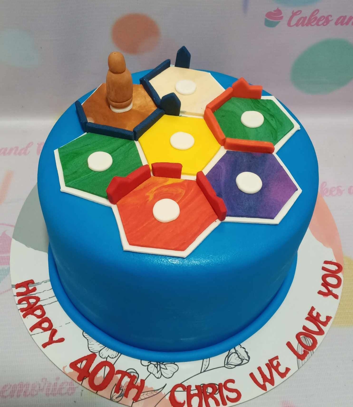 This custom Dad Cake features a striking blue fondant icing design inspired by the Settlers of Catan board game, perfect for celebrating Father's Day or a birthday. With its sleek one-tier style, this cake is an ideal treat for any gentleman in your life.