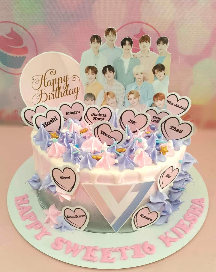 A stunning 1-tier Going Seventeen Cake in white, pink, and purple, perfect for celebrating a happy 16th birthday for a Kpop fan. This custom decorated cake features elements inspired by the popular Kpop group Seventeen, ideal for a sweet sixteen celebration.