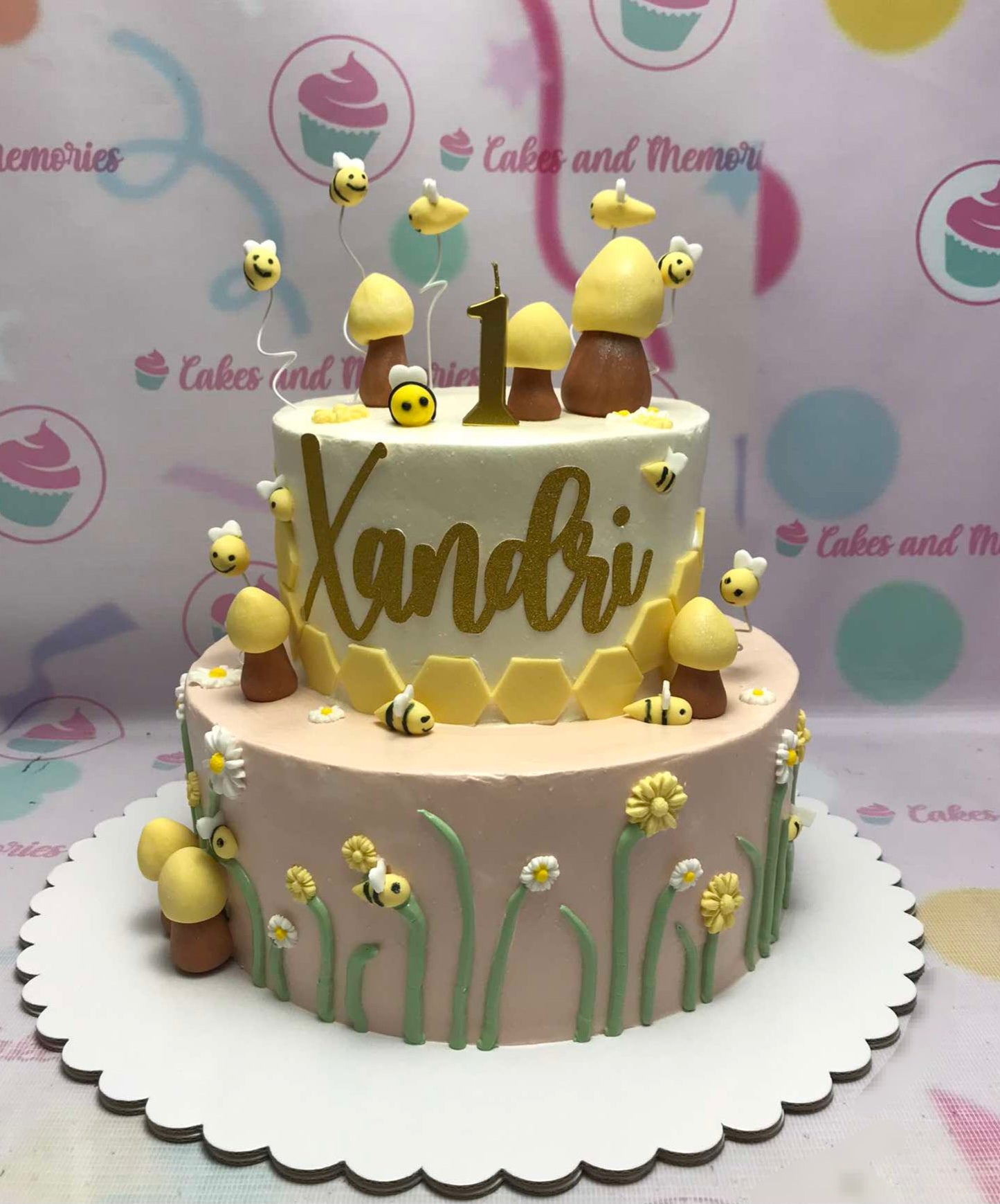 This vibrant Bugs Cake features a stunning two-tier design adorned with yellow and gold accents, showcasing charming honey bees and intricate insect details. Perfect for garden-themed birthday celebrations, this customized cake brings a whimsical touch to any special occasion.