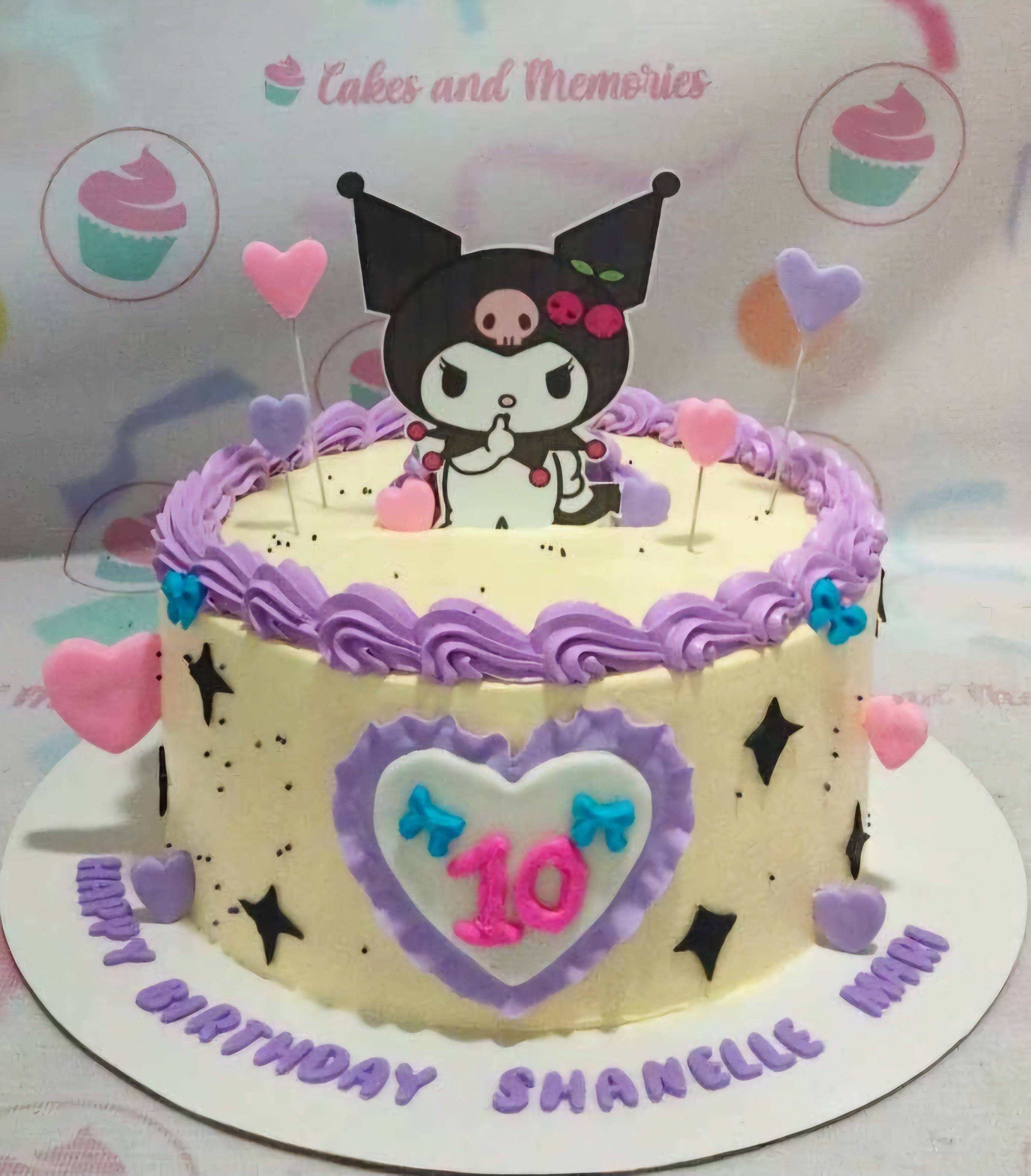 This adorable Kuromi Cake features a clean white cream base with a charming purple border, beautifully adorned with heart-shaped printout toppers of beloved characters like Hello Kitty and My Melody. Perfect for any celebration, this one-layer, one-tier cake brings a touch of Sanrio magic to your special occasion!