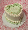 Showcasing a stunning pale-green heart-shaped bride cake, this vintage design features mint green icing and delicate gold beads, perfect for a bride-to-be's bridal shower. This elegant one-tier masterpiece exudes charm and sophistication.