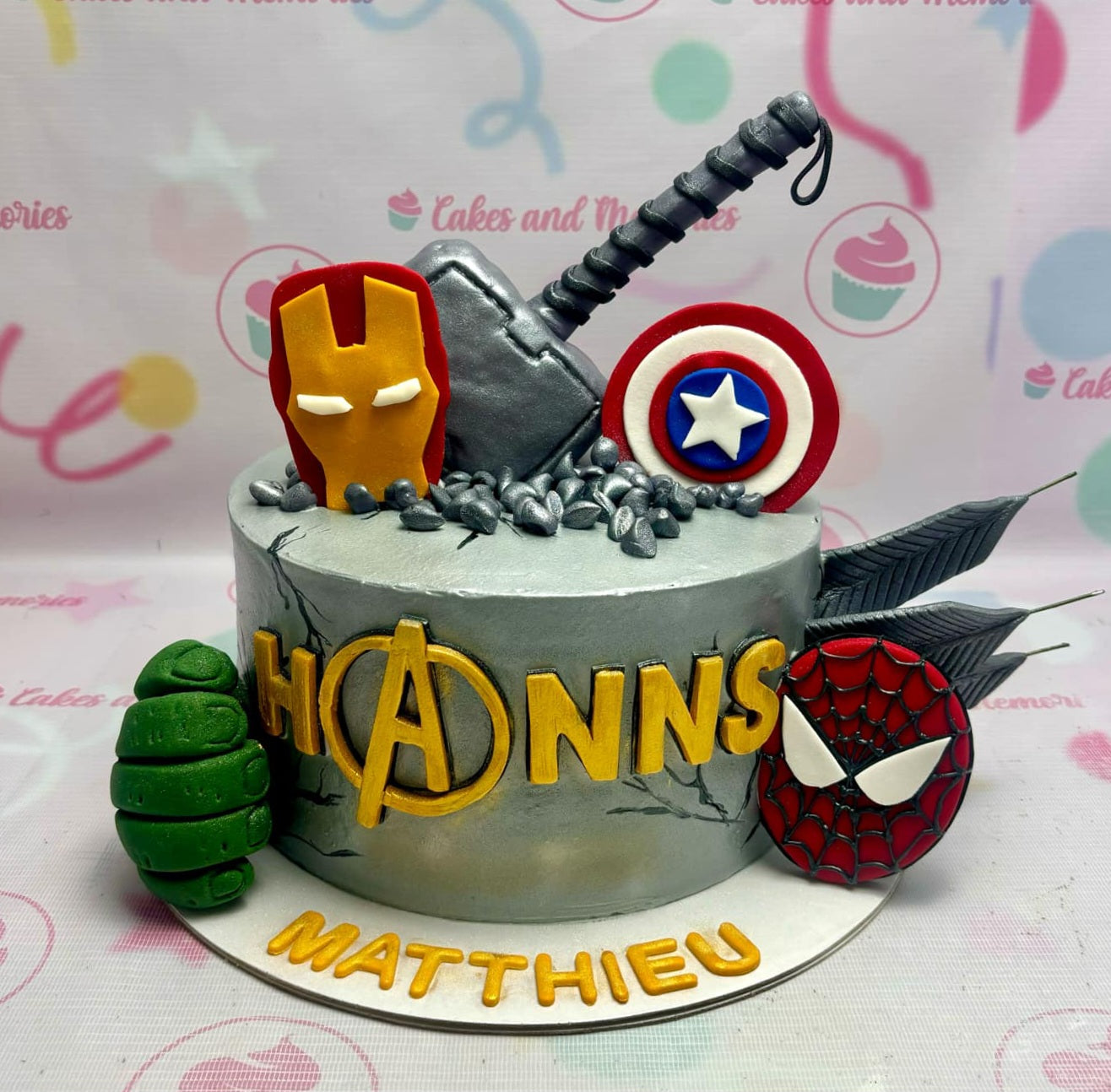 Unleash the power of your favorite superheroes with this stunning one-tier Avengers Cake, featuring sleek silver icing and vibrant edible toppers. Perfect for any kid's celebration, this cake brings the excitement of Marvel's Avengers to life!