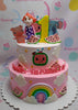 This custom Cocomelon cake features two pink tiers adorned with clouds, an edible rainbow, and playful printout toppers of a pig and elephant, perfect for a baby girl's 1st birthday celebration. The design includes a fun watermelon theme and a prominent 