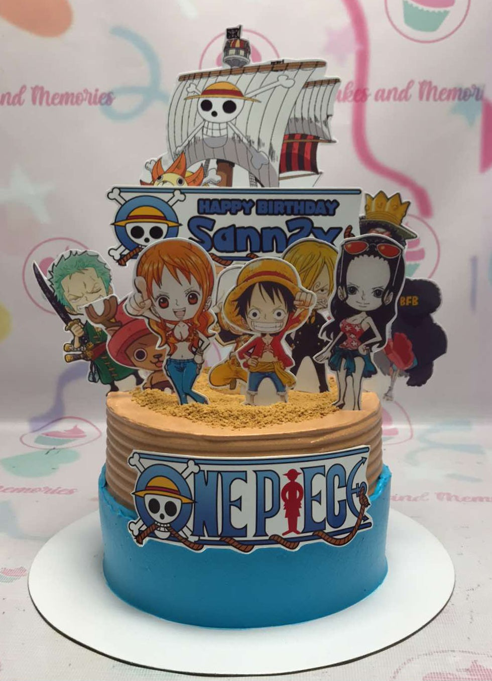 This vibrant One Piece Cake features a brown and blue color scheme, adorned with detailed printout toppers of Luffy, Nami, Zoro, Robin, Sanji, Brook, Usop, and Chopper, perfect for any anime-themed birthday celebration. The single-tier design makes it an ideal choice for kids who love pirates and their favorite characters from One Piece.