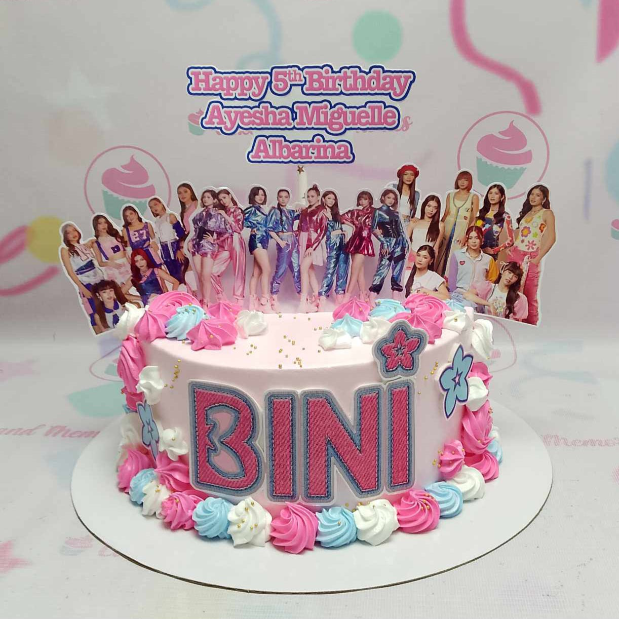 Introducing the stunning Bini Cake, adorned in vibrant pink and purple with delightful Bini Blooms that celebrate the essence of Ppop and Kpop. This single-tier masterpiece is perfect for any fan looking to add a splash of color to their special occasion!