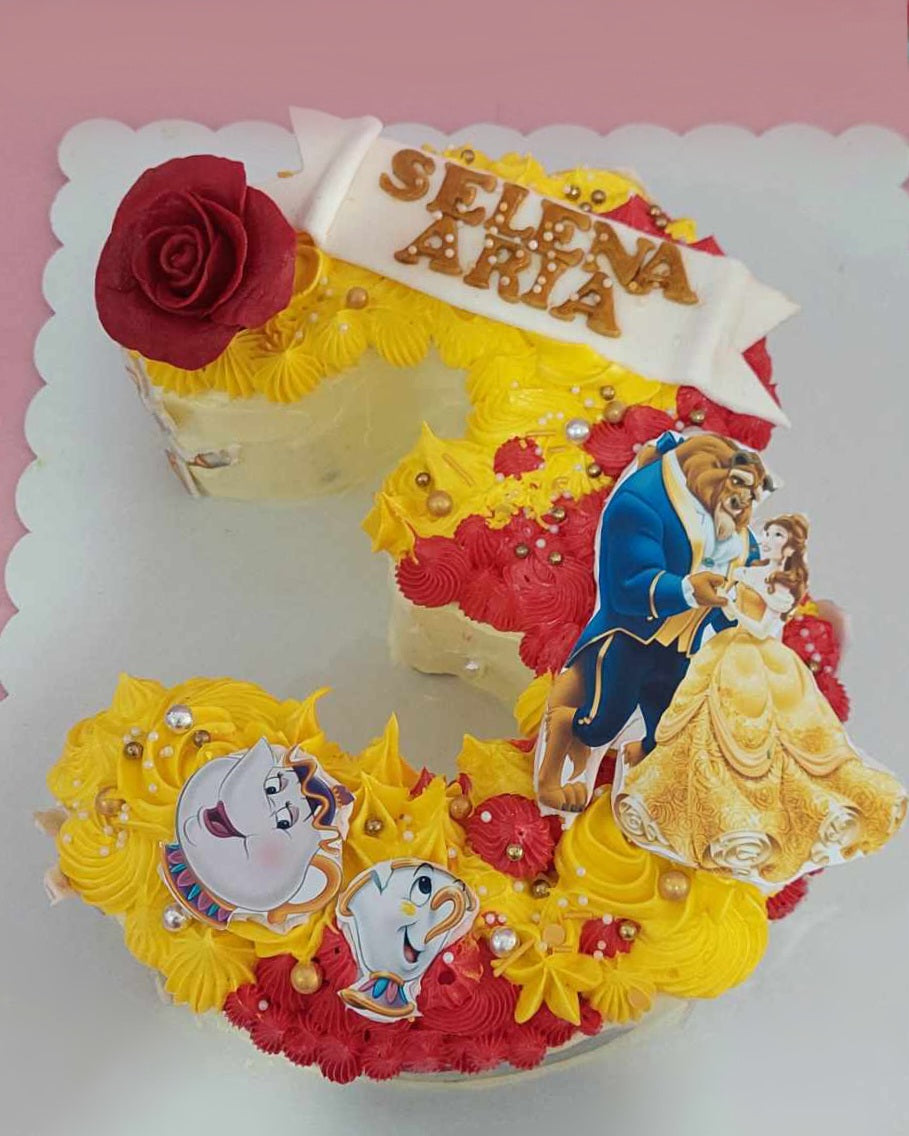 This stunning Belle Cake features a rectangular design adorned with red roses, sprinkles, and touches of gold for a magical Beauty and the Beast theme. Perfect for a 3rd birthday celebration, this customized cake showcases a playful number 3 and bright yellow accents, making it a delightful choice for any Disney princess fan.