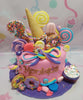 This colorful Candyland Cake features vibrant pink and purple fondant, perfect for a 3rd birthday celebration. Adorned with playful donuts, lollipops, and ice cream, it’s a delightful centerpiece wrapped in a sweet ribbon.