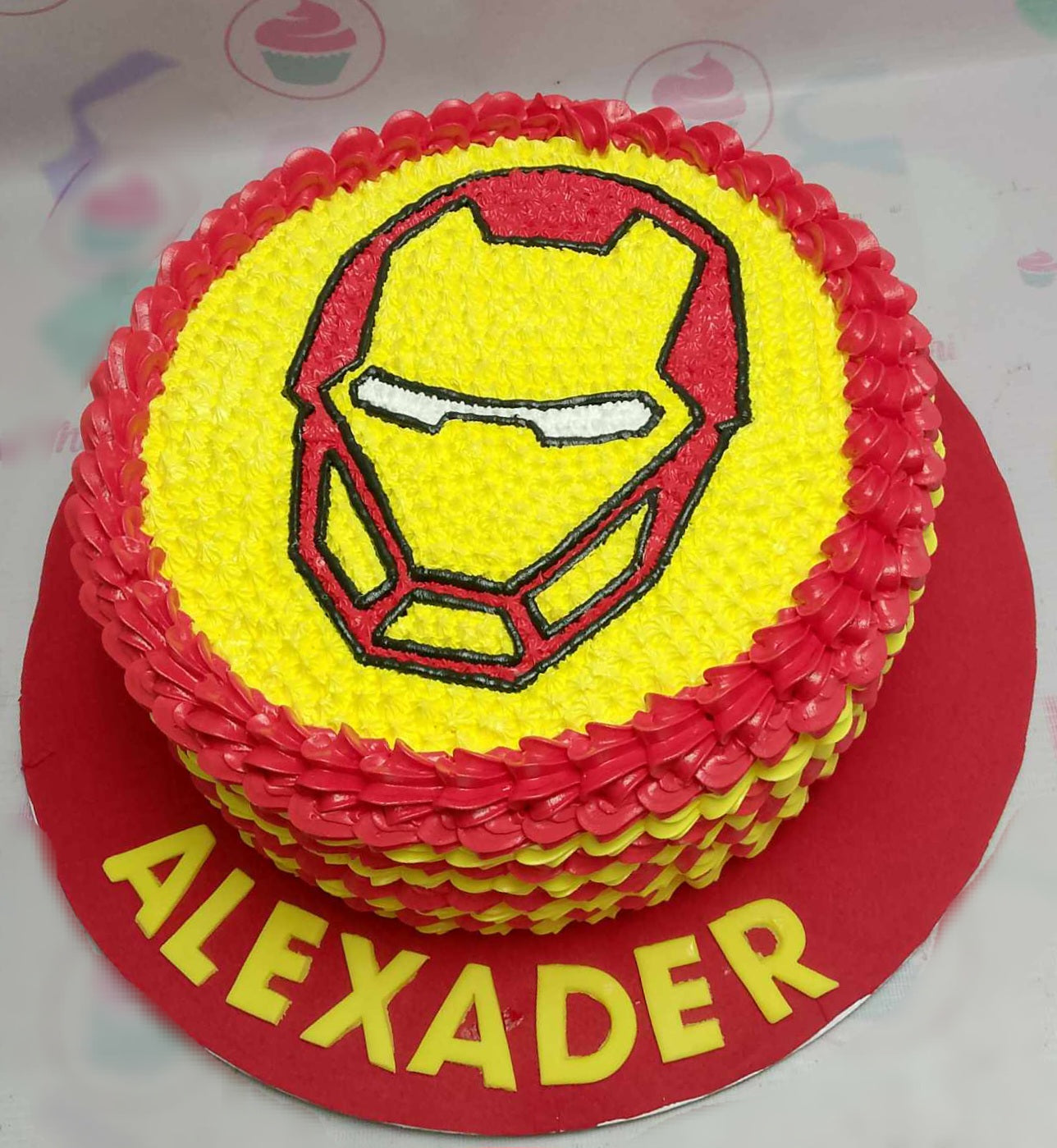 This custom Avengers cake features a striking yellow and red design, with Iron Man prominently displayed, perfect for a birthday celebration for Alexander. Emblazoned with Marvel Superheroes motifs, this one-tier cake is a true homage to comic book fans and the MCU.