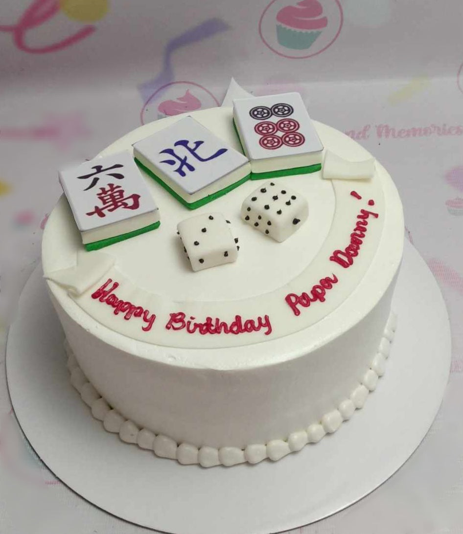 This custom Mahjong Cake features a clean white design adorned with intricate mahjong tiles and vibrant dice in red, green, and black with playful dots. Perfect for celebrating Happy Birthday Papa Donny, this one-tier, one-layer cake includes personalized printout toppers to honor family members like tito, tita, lolo, and lola.