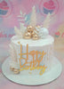 This vibrant Fifty Cake features a sleek white design adorned with gold balls, gold sprinkles, and a happy birthday gold topper, complemented by decorative edible leaves and whimsical feathers. Perfect for celebrating a beloved grandfather or grandmother in a modern and contemporary style.