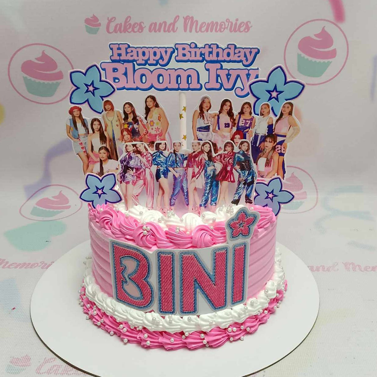 Introducing our stunning Bini Cake, a one-tier masterpiece adorned with delicate pink blooms, perfect for any Ppop or KPop celebration. This eye-catching design embodies the vibrant spirit of Bini, making it a delightful centerpiece for your special occasion.