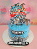 This Tobot-themed cake features a striking blue design with cars and robots set against a cityscape backdrop. Adorned with silver sprinkles and printed cartoon toppers, it’s perfect for a boy’s 4th birthday celebration.