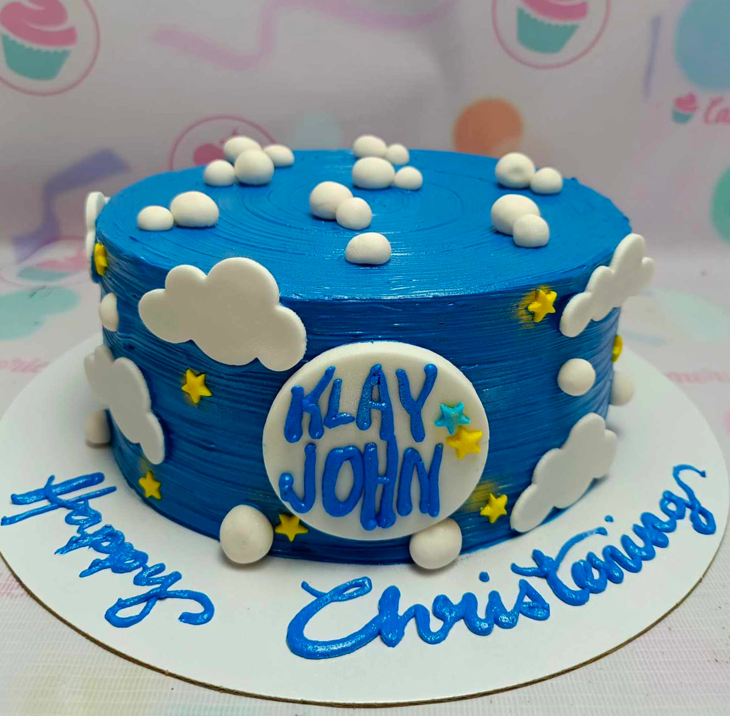 This charming Christening Boy Cake features a serene blue theme with fluffy cloud details, perfect for celebrating a happy christening. It is a one-tier, custom-designed cake ideal for a baby boy's baptismal or birthday celebration.