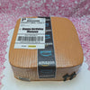 A rectangular cake adorned with brown icing features an Amazon package design, complete with a barcode and delivery box elements. Perfectly themed for a birthday celebration for Mommy, it captures the essence of online shopping and ecommerce.