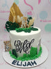 This vibrant 1-tier Safari Cake features a playful design with a white and green color palette, showcasing adorable animal printout toppers including a baby tiger, lion, zebra, and giraffe. Perfect for celebrating a 