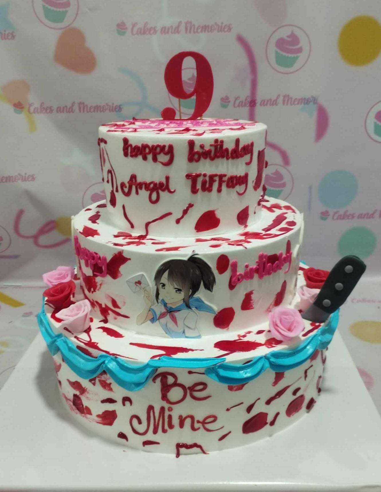 This striking 3-tier Video Games Cake features a white and red color scheme, adorned with gruesome printout toppers from the Yandere Simulator game, complete with knife and blood accents, elegantly accompanied by roses and a "Be Mine" message. Perfect for a themed birthday celebration, it's an eye-catching custom creation for kids who love video games.