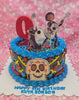 This custom Coco Cake features rich black icing accented with blue flowers, showcasing Miguel and Dante with a guitar and skull motifs. Topped with printout decorations, it celebrates a 9th birthday in honor of Kuya Bonbon, perfect for a Dia de Muertos theme.