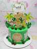 This adorable Safari Cake features a vibrant green design, perfect for a wild one’s 1st birthday. Adorned with cute animal printout toppers like a giraffe, lion, and monkey, this one-tier cake captures the essence of a jungle adventure.