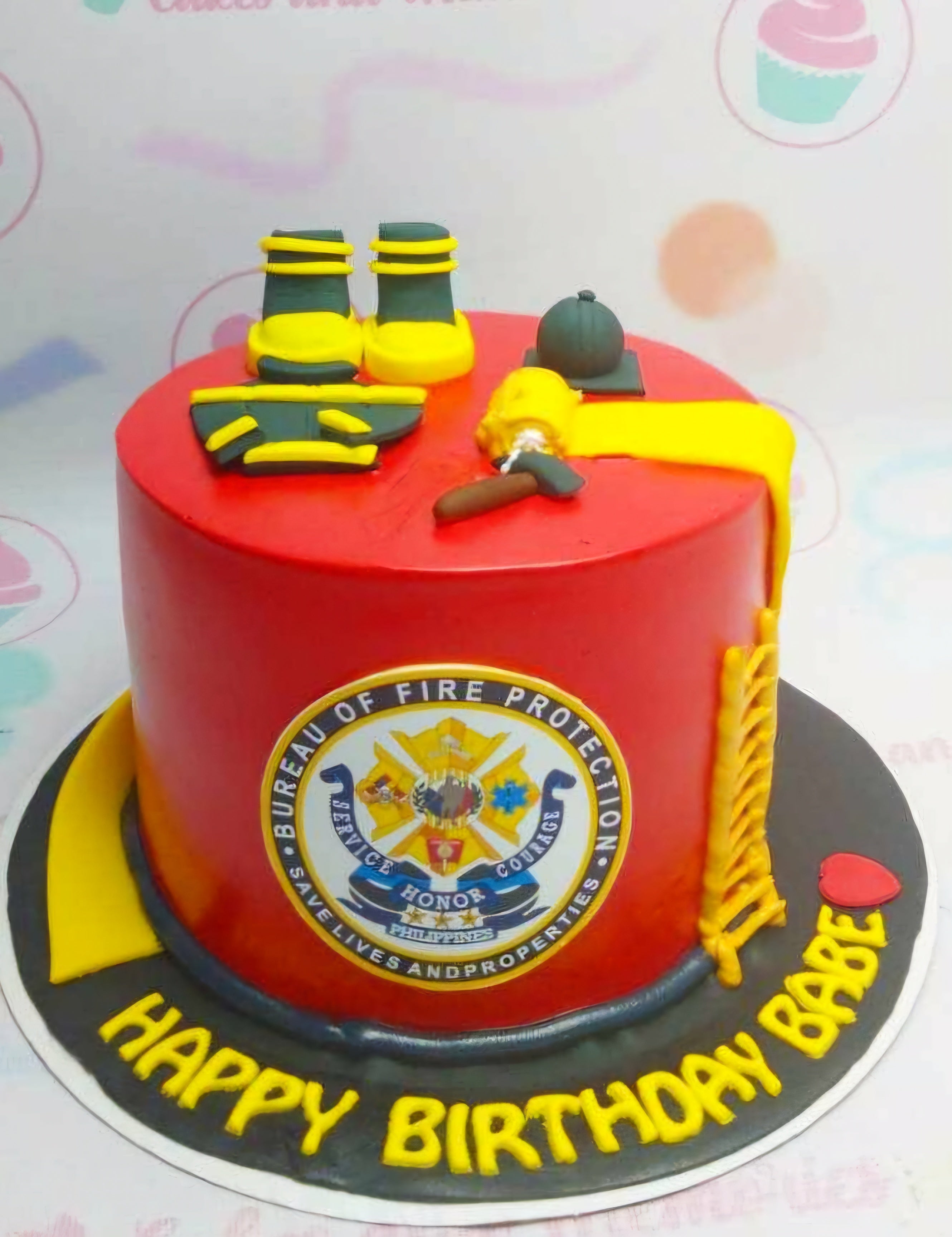 This vibrant Fire Fighter Cake features a striking combination of red and yellow, adorned with themed printout toppers representing the Bureau of Fire Protection and brave firefighter heroes. This custom 1-tier cake brings the excitement of firetrucks and water hoses to any birthday celebration.