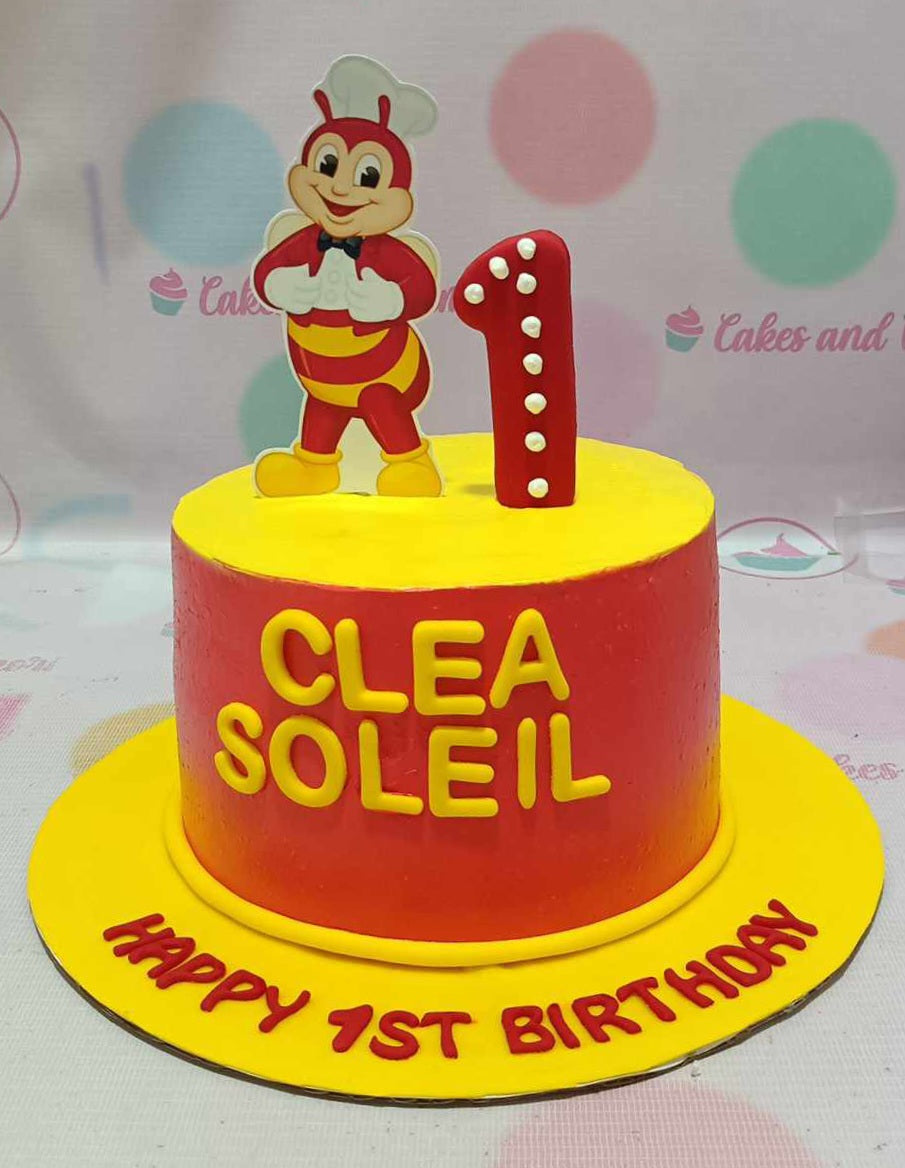 This vibrant Jolibee Cake features a bold yellow and red design, showcasing beloved fast food characters and printed toppers that perfectly capture the spirit of "Bida and Saya." Ideal for birthdays, this one-tier cake is a delightful addition to any celebration.