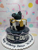 This striking two-tier military cake features a bold black and gray camouflage design, complete with an impressive edible grenade topper, perfect for any Call of Duty fan or soldier-themed birthday celebration. Customize your cake to honor the special soldier in your life with this captivating and unique design.