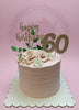 One-tier rose gold 60th birthday cake with striped buttercream, sugar roses, and gold 'happy birthday 60' toppers.