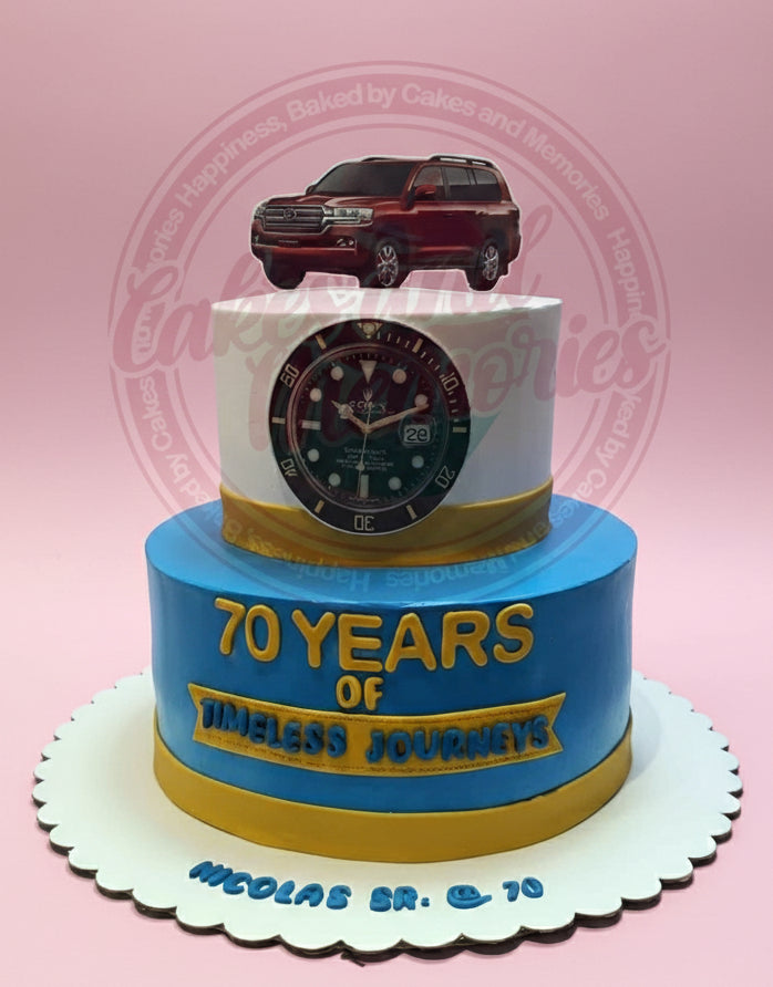2-tier birthday cake with red Land Cruiser, Rolex watch, '70 Years of Timeless Journeys' in blue, white, and gold.