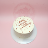 Round anniversary cake with 'fifty second and counting' text, red and white piped hearts, and sprinkles on white buttercream.