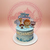 Light blue christening cake with cute safari animal toppers, 'Happy Christening' and 'ARCHIMEDES' in white letters. Custom cake.