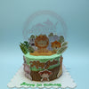 One-tier safari birthday cake for Klay John's 1st birthday, with cute animal and leaf toppers on green and brown buttercream.