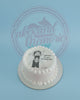 One-tier round birthday cake with white buttercream and an edible print of One Piece's Luffy saying 'Sugeeeee it's your birthday, Pat!'