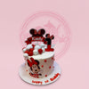 One-tier Minnie Mouse 1st birthday cake for Kaely, with edible print, custom topper, and red & white spheres.