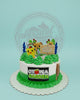 One-tier custom birthday cake with a Minecraft-inspired garden theme, featuring a farmer, house, plants, and 'Happy Birthday Thirsty' sign in green, white, and yellow.