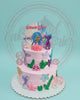 Two-tier mermaid birthday cake with Princess Dara photo topper, pink buttercream, mermaid tails, starfish, coral, and bubbles.