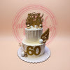 Two-tier 60th birthday cake with elegant white and gold drip design, 
