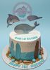 One-tier under the sea birthday cake with whale, dolphin, manta ray toppers, blue and brown buttercream, 