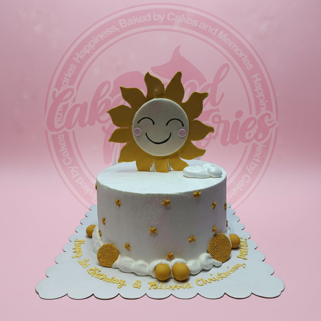 One-tier custom buttercream cake with a smiling sun topper, gold stars, and 'Happy 1st Birthday & Beloved Christening' text.