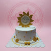 One-tier custom buttercream cake with a smiling sun topper, gold stars, and 'Happy 1st Birthday & Beloved Christening' text.