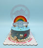 One-tier Cinnamoroll birthday cake for Natalie's 7th birthday with blue buttercream, rainbow topper, and ice cream cone details.
