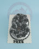 Custom number 8 birthday cake with grey buttercream rosettes, white sprinkles, and 'TRES' text on a white board.